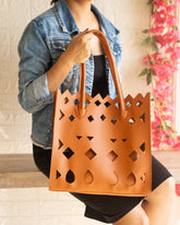 Laser cut handbag with pouch